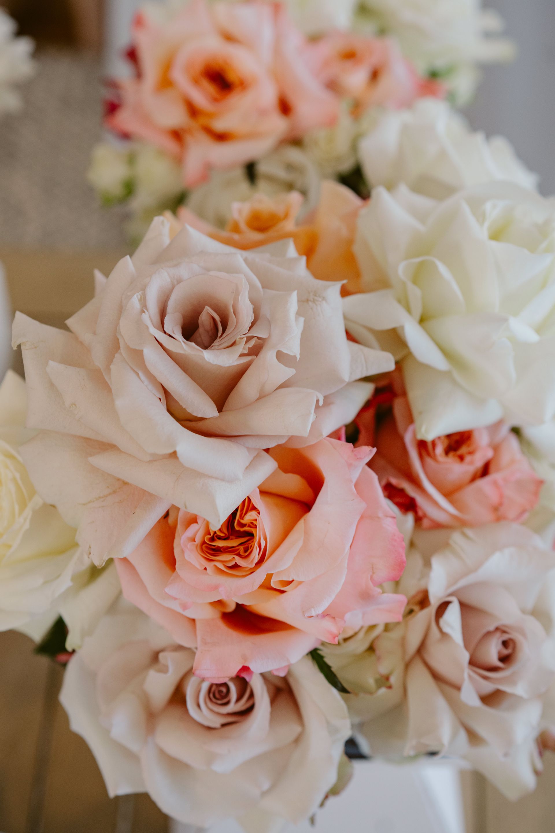 Bouquet of pale pink, peach, and cream roses