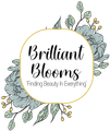 &ldquo;Brilliant Blooms&rdquo; floral logo with &ldquo;Finding Beauty in Everything&rdquo; on a white circle