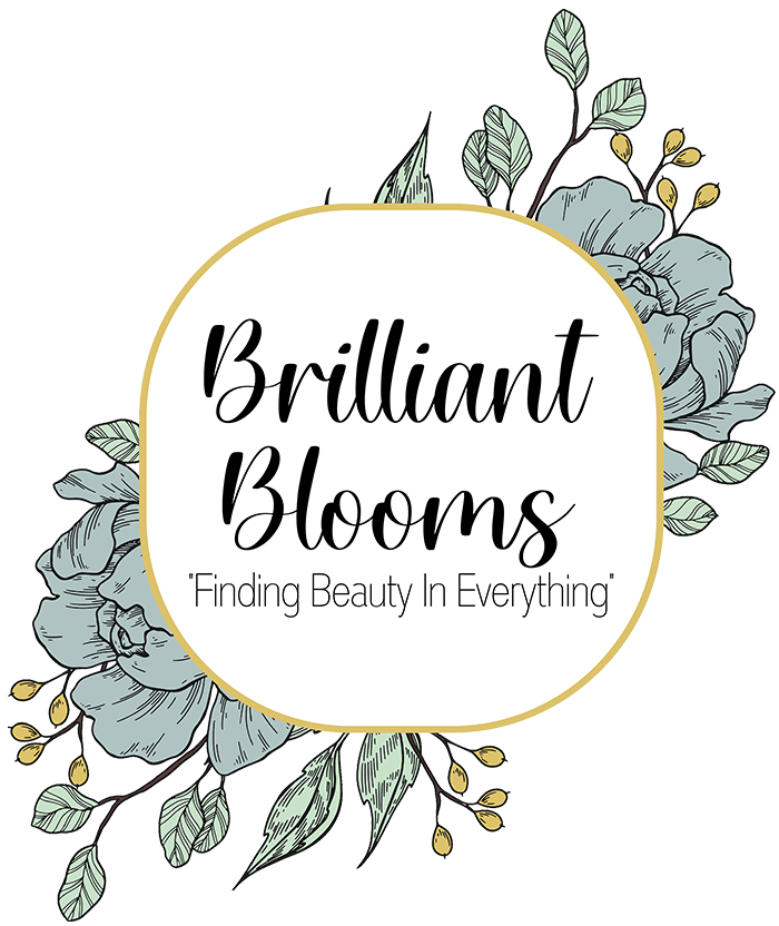 &ldquo;Brilliant Blooms&rdquo; floral logo with &ldquo;Finding Beauty in Everything&rdquo; on a white circle