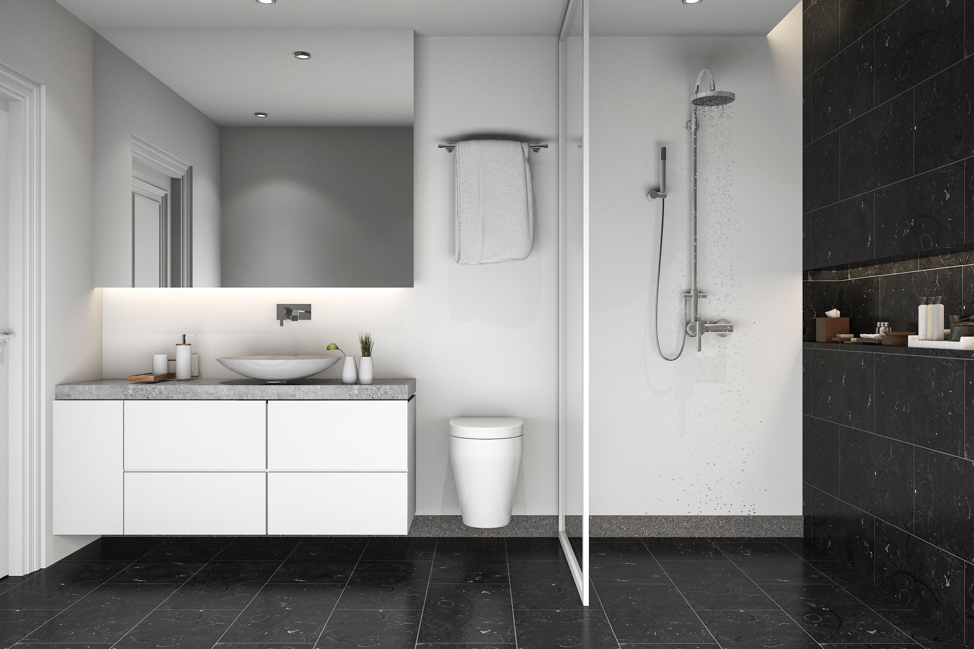 A bathroom with a walk in shower , sink , toilet and mirror.