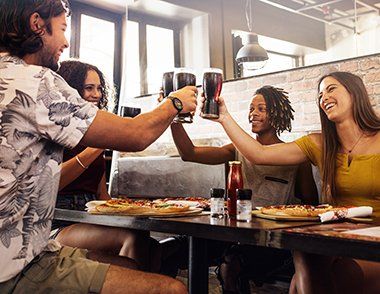 People toasting with glasses of beer | Bars & Brews | Covell Communities | Chester, Maryland 21619