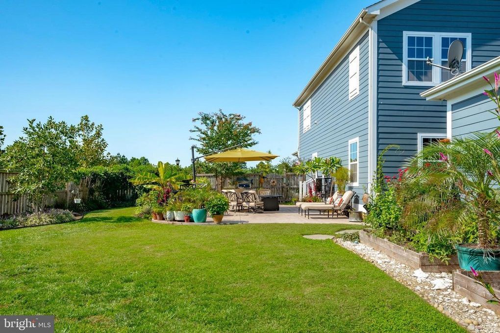 A large house with a large lawn in front of it.