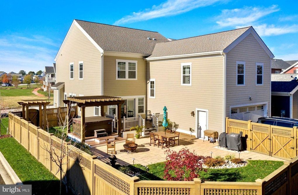 Bird eye view of back of cream colored home in mid afternoon sunlight | Covell Communities | Chester, Maryland 21619