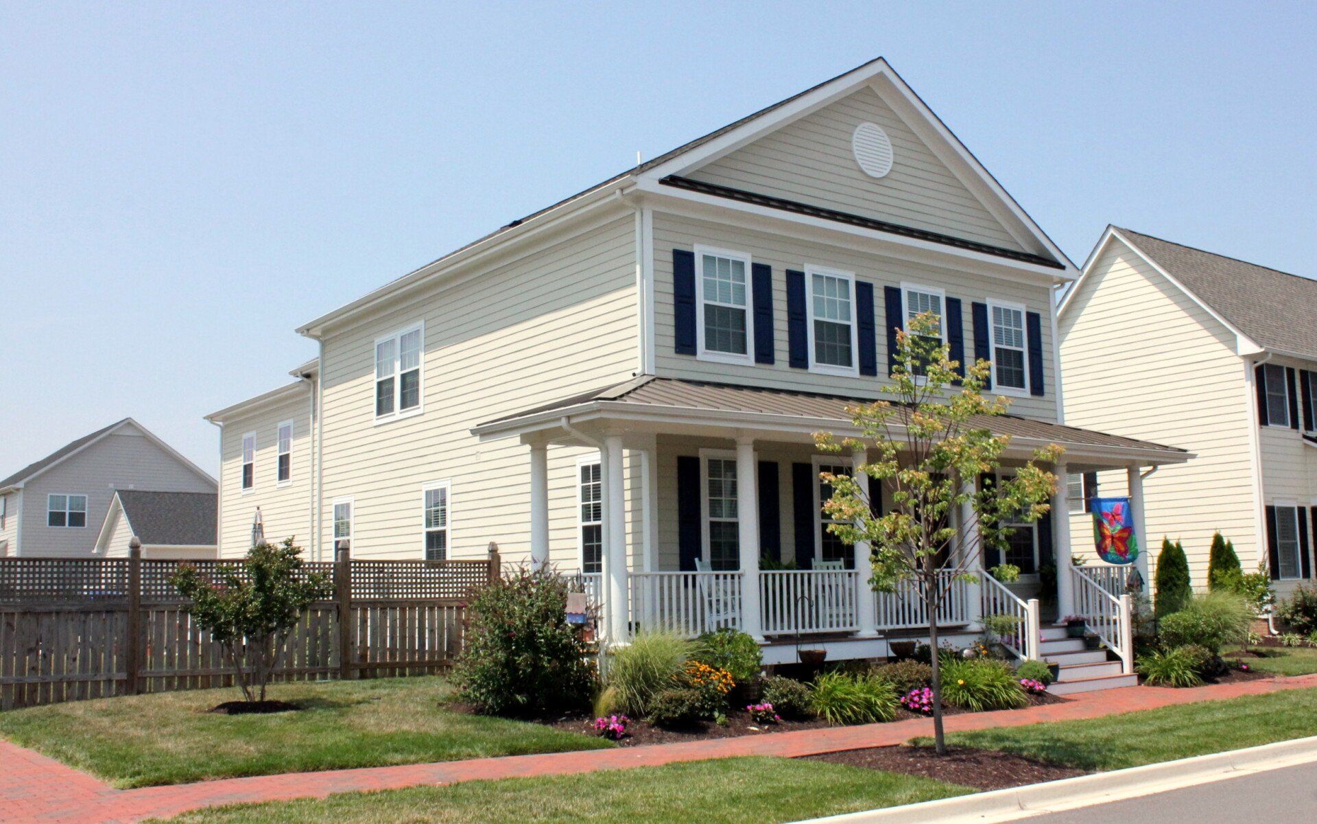 Yellow home with porch exterior | Port Royal Executive | Covell Communities | Chester, Maryland 21619
