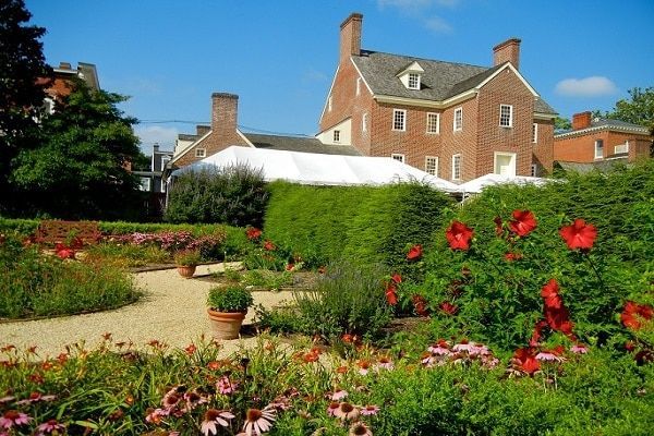 Brick home with roses| Eastern Shore History | Covell Communities | Chester, Maryland 21619
