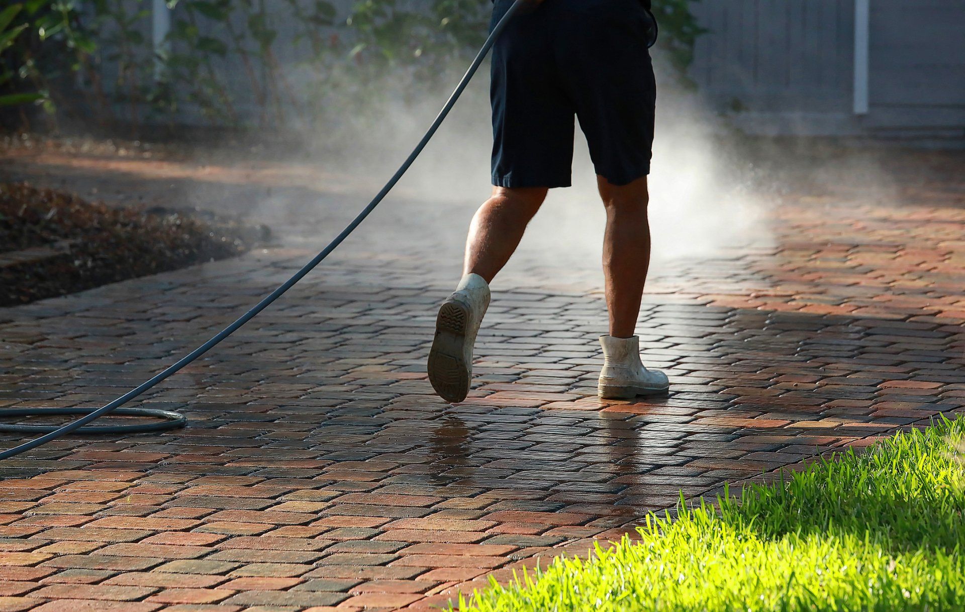 Cleaning Driveway With Pressure Washer — Jacksonville FL — Paver Protections LLC Cleaning Driveway With Pressure Washer — Jacksonville FL — Paver Protections LLC