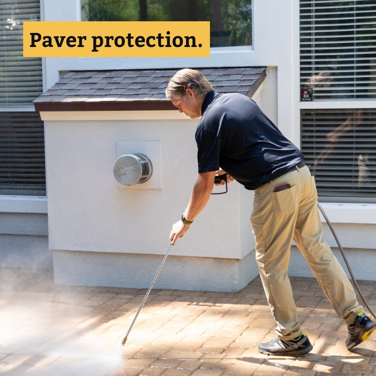 Man Applies Protection In Pavement — Jacksonville FL — Paver Protections LLC