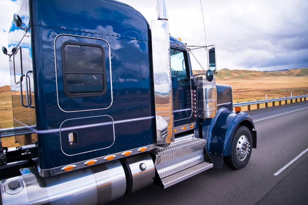 Blue Semi-truck Driving on a Highway — Mission Truck Training in Noosa, QLD