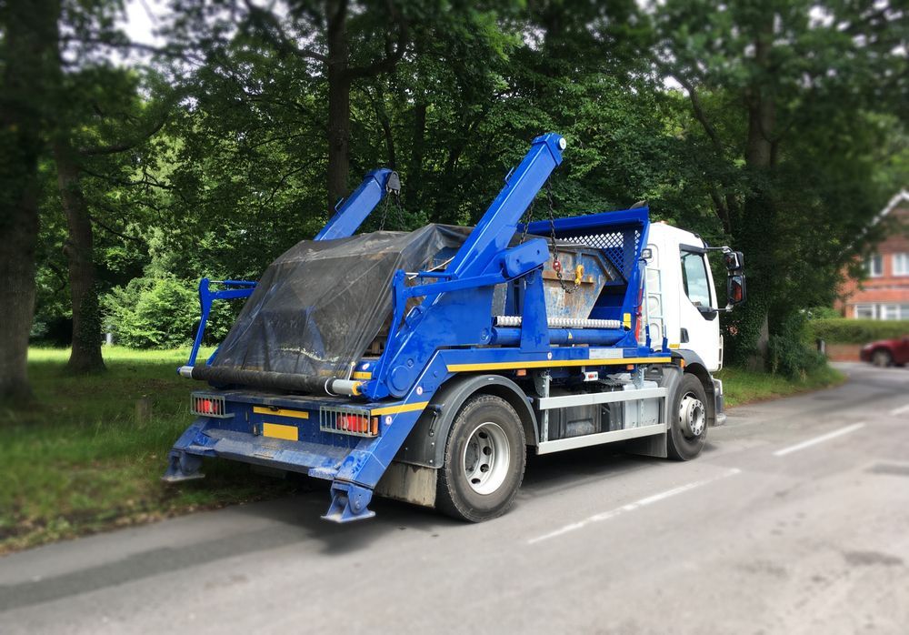Blue and White Hook-lift Truck Parked on a Road, With a Large Container — Mission Truck Training in Mountain Creek, QLD