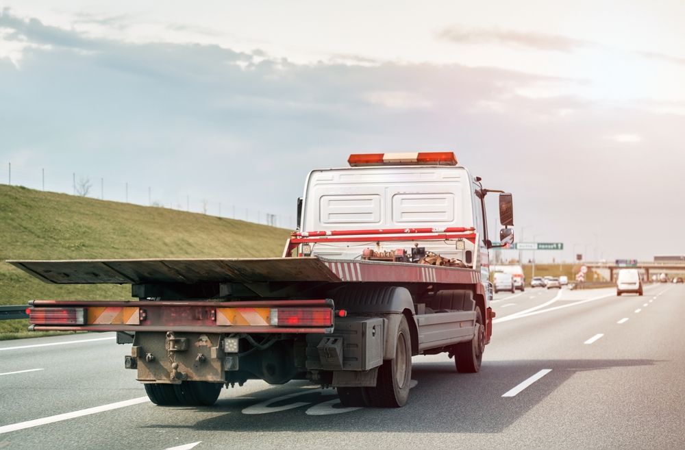 Tow Truck Driving on a Highway, Flatbed Empty — Mission Truck Training in Noosa, QLD
