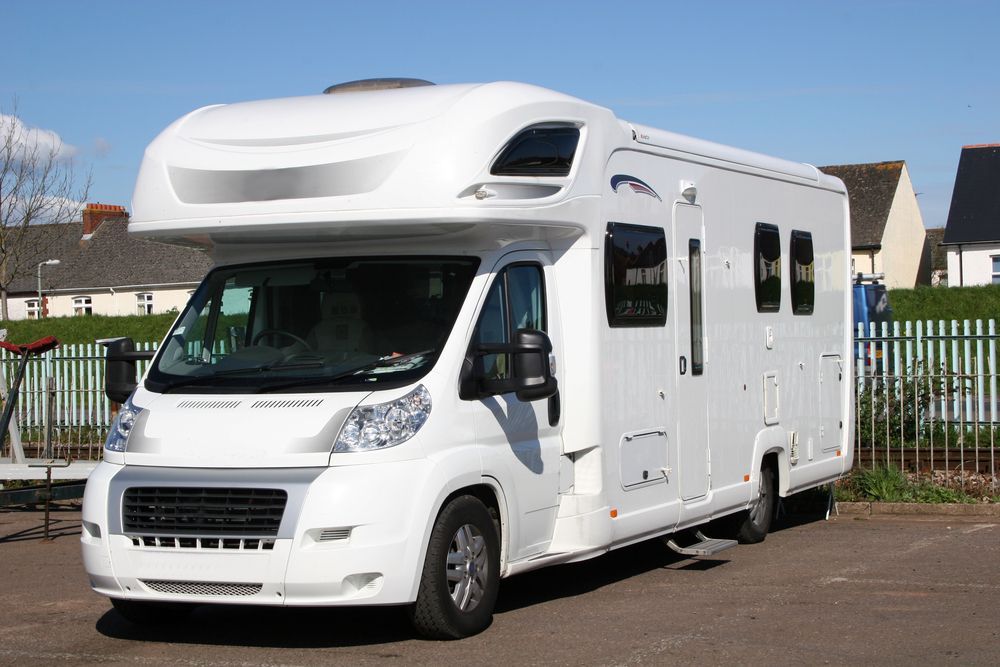 White Motorhome Parked on Pavement, Bright Sunny Day — Mission Truck Training in Gympie, QLD