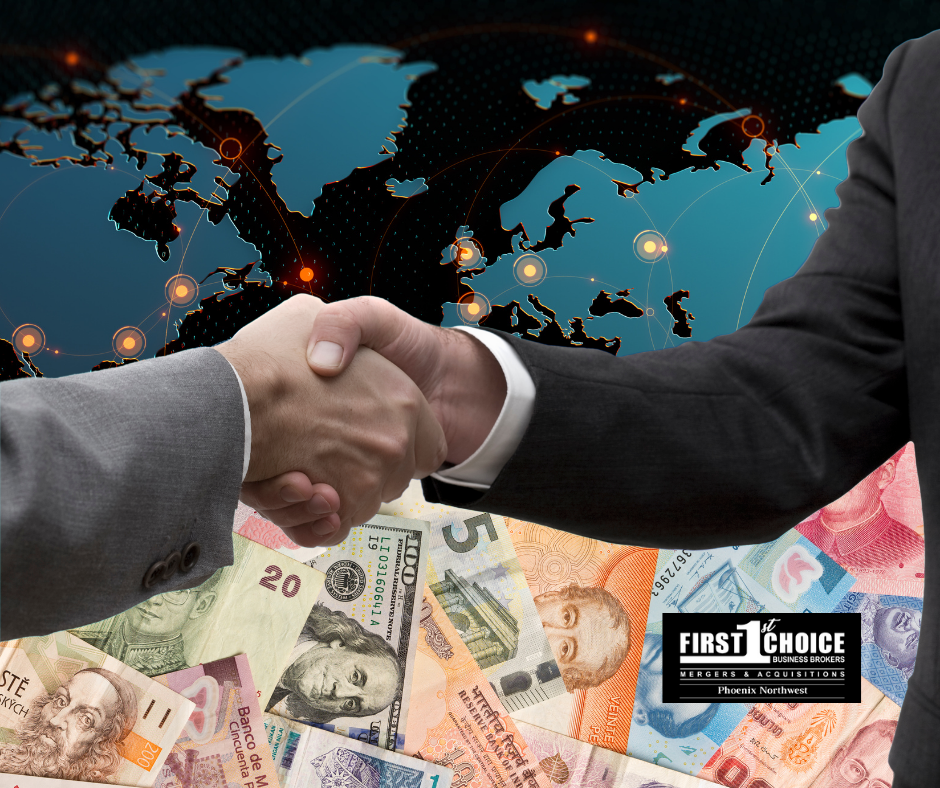 Two men shaking hands in front of a map of the world
