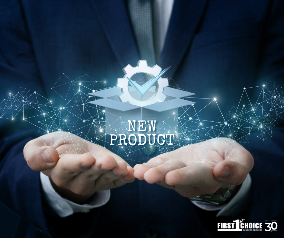 A man in a suit is holding a new product in his hands