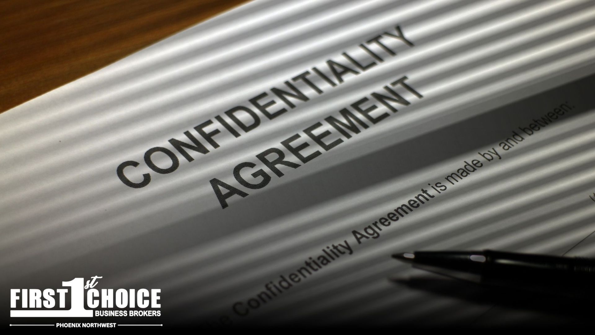 A close up of a confidentiality agreement with a pen