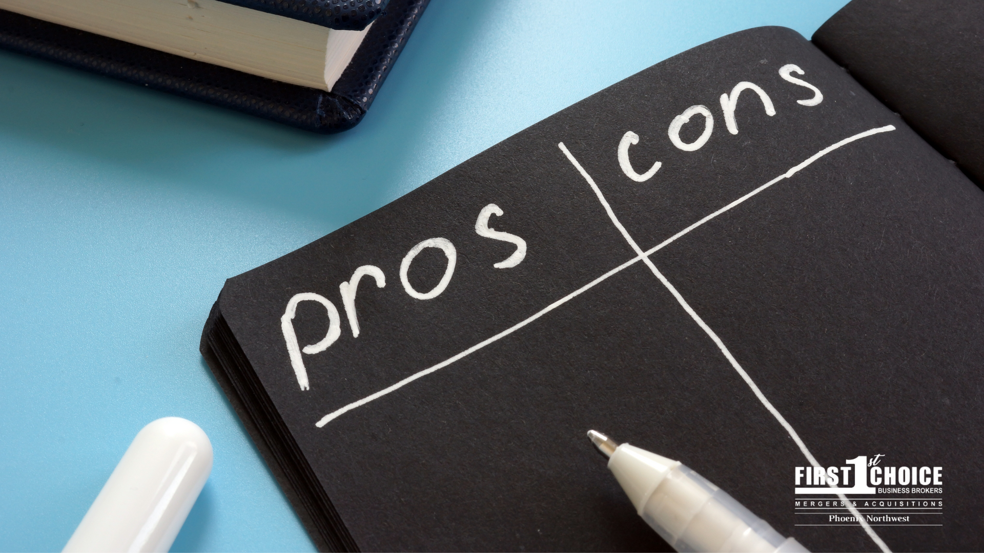 A notebook with pros and cons written on it