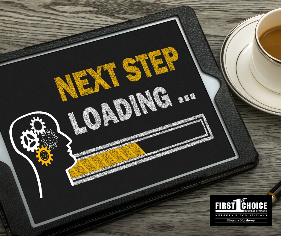 A tablet that says next step loading next to a cup of coffee
