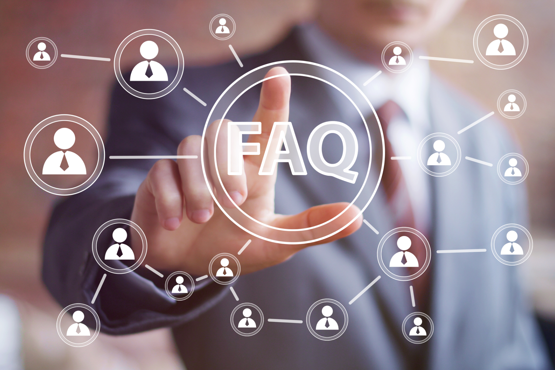A man is pressing a button on a screen that says faq.