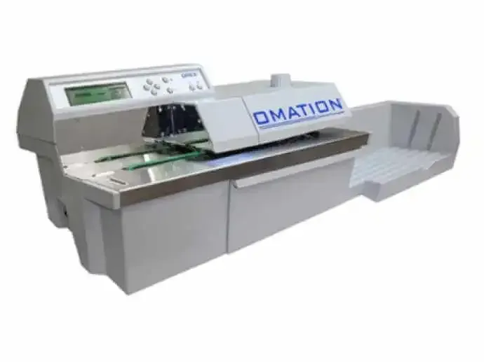 A white machine with the word omation on it
