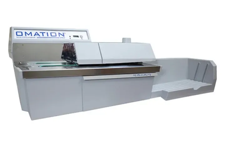 A white machine with the word omation on it
