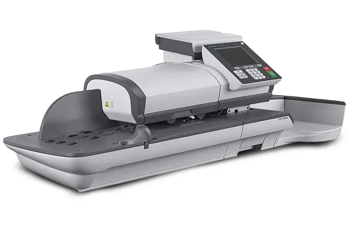 A machine that is sitting on a table on a white background.