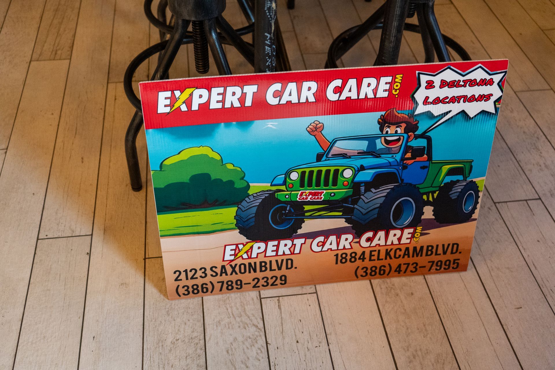 Expert Car Care toy-box package with red Jeep graphic on a wooden floor