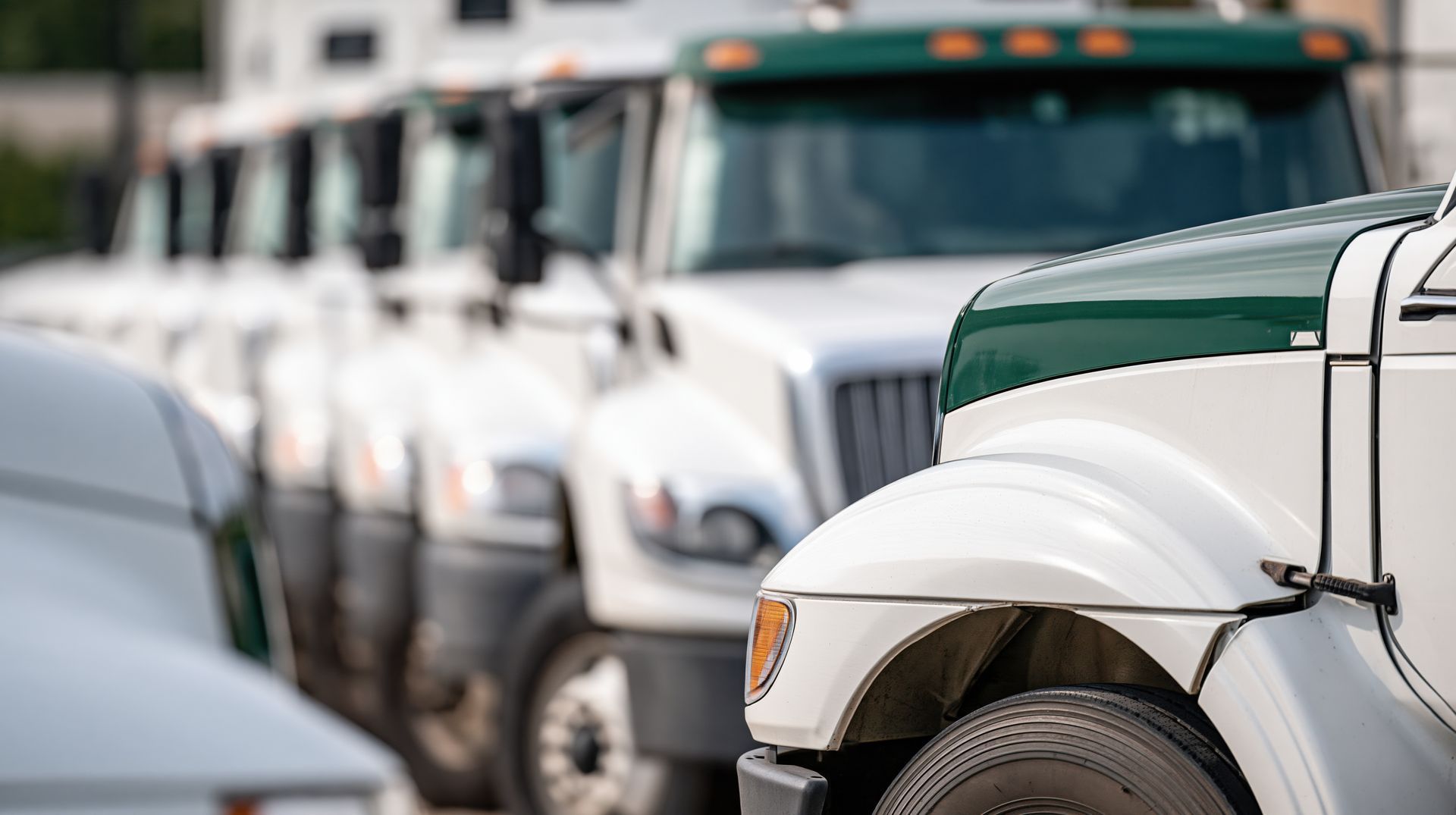 Row of commercial medium duty trucks lined up for fleet diesel repair and brake services Row of commercial medium duty trucks lined up for fleet diesel repair and brake services