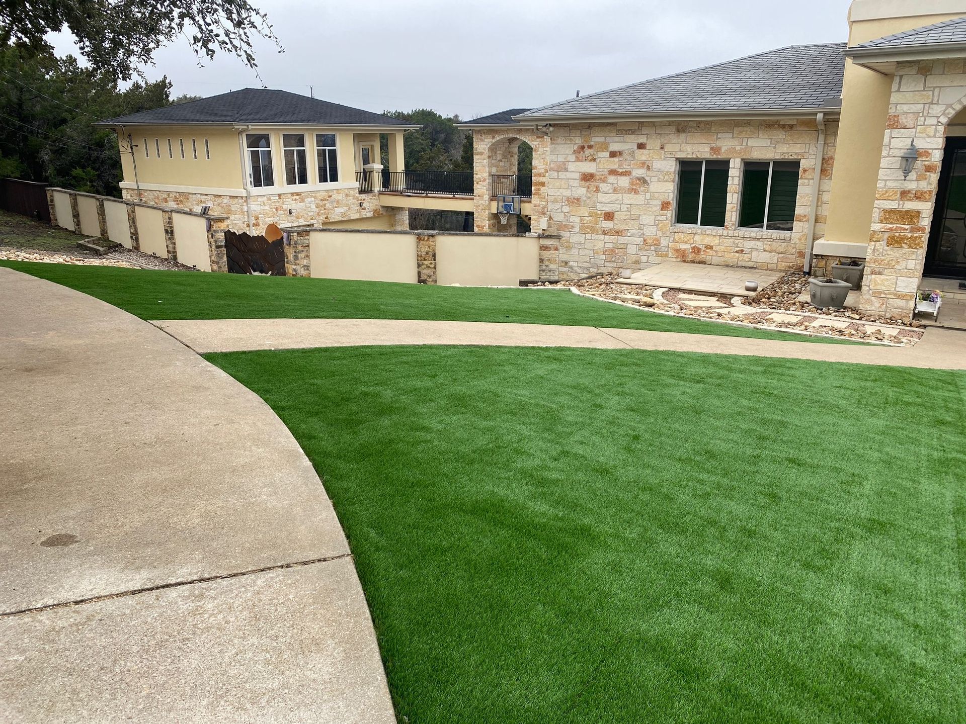 A large house with a lush green lawn in front of it.