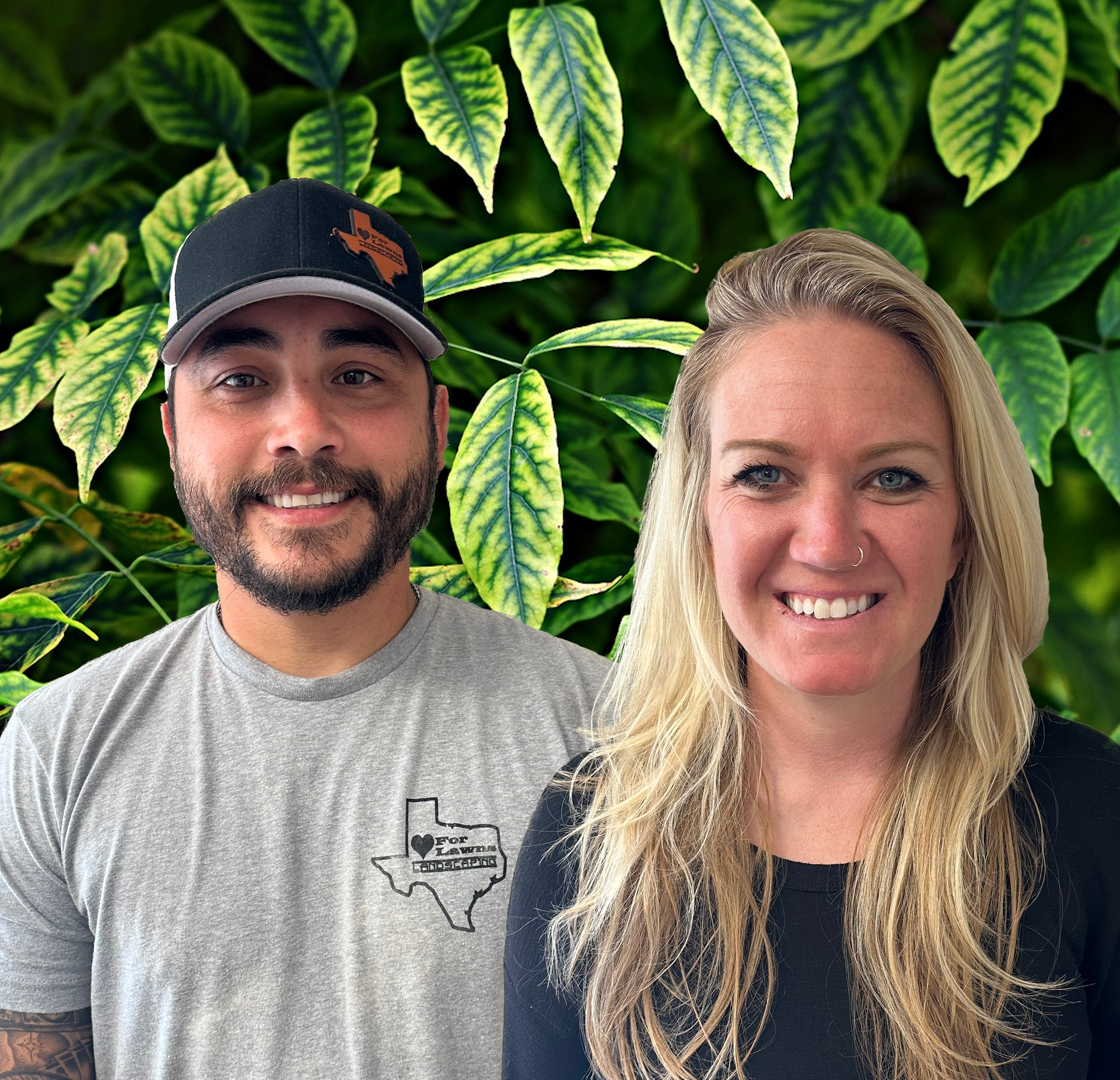 A man and a woman are posing for a picture with leaves in the background.