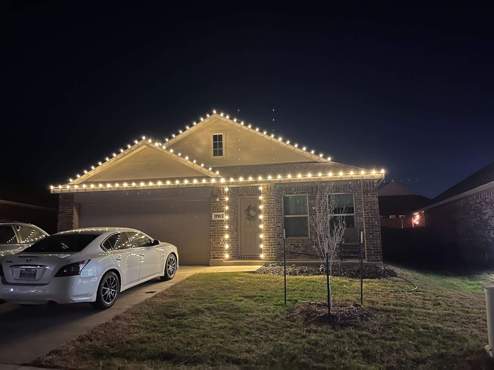 a house decorated with christmas lights.