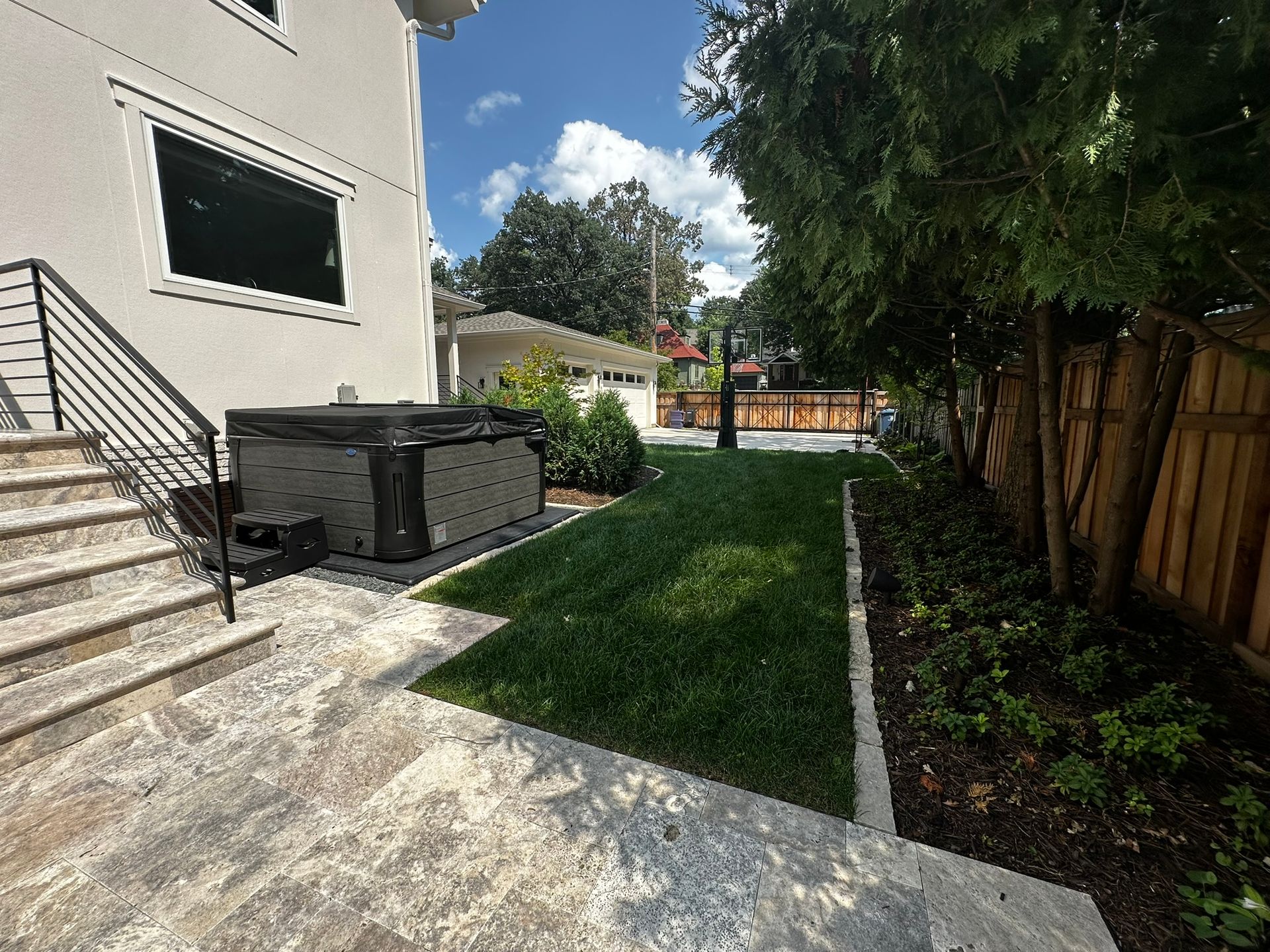 After: new hot tub.  We designed placement, prepped the base pad with gravel, got electrical installed, planted privacy shrubs 