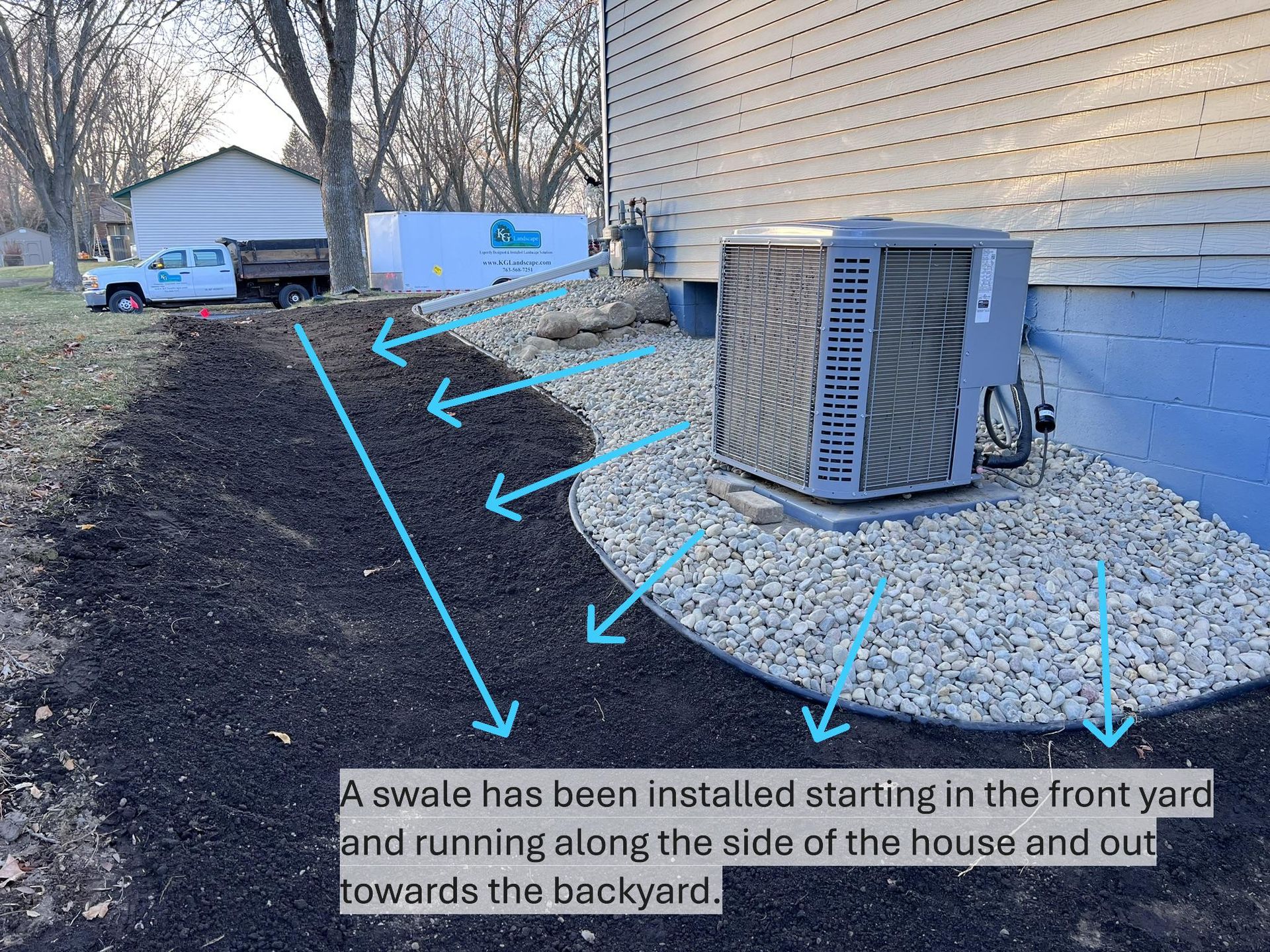 newly regraded yard and foundation landscaping in side yard designed to send water away from the foundation  