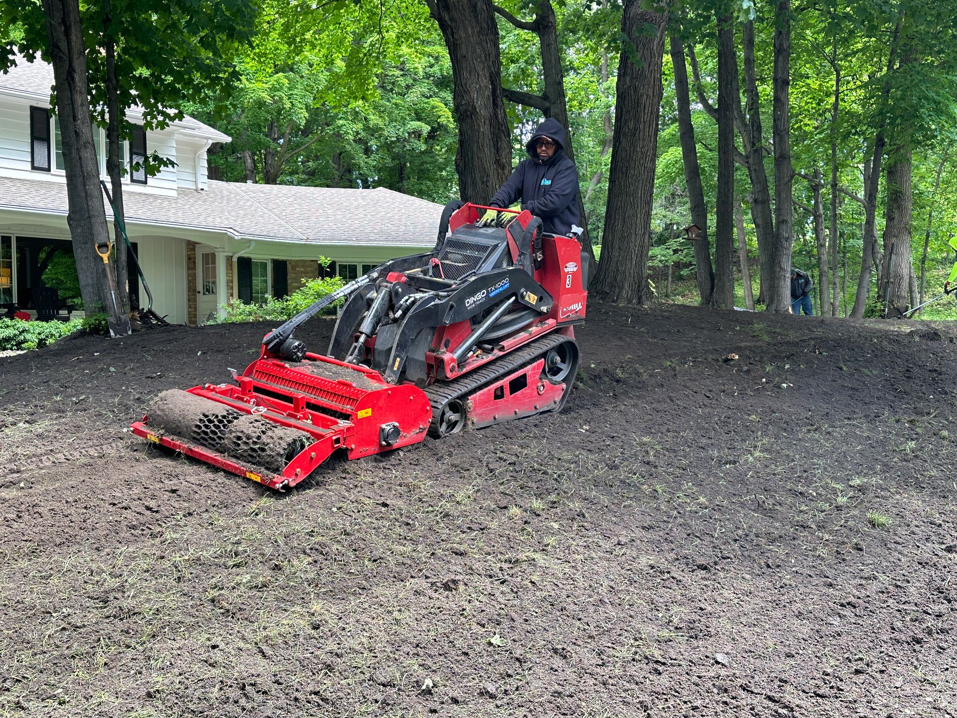 regrading a lawn with soil conditioner attachment in Eden Prairie MN 