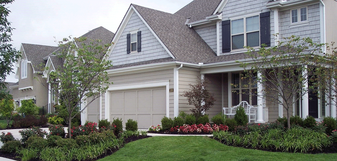 front yard with curb appeal and small shrubs