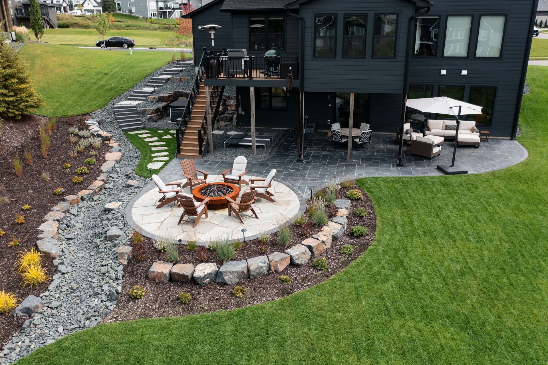 Dry creek bed installed in side yard to remove pooling water in lawn. 