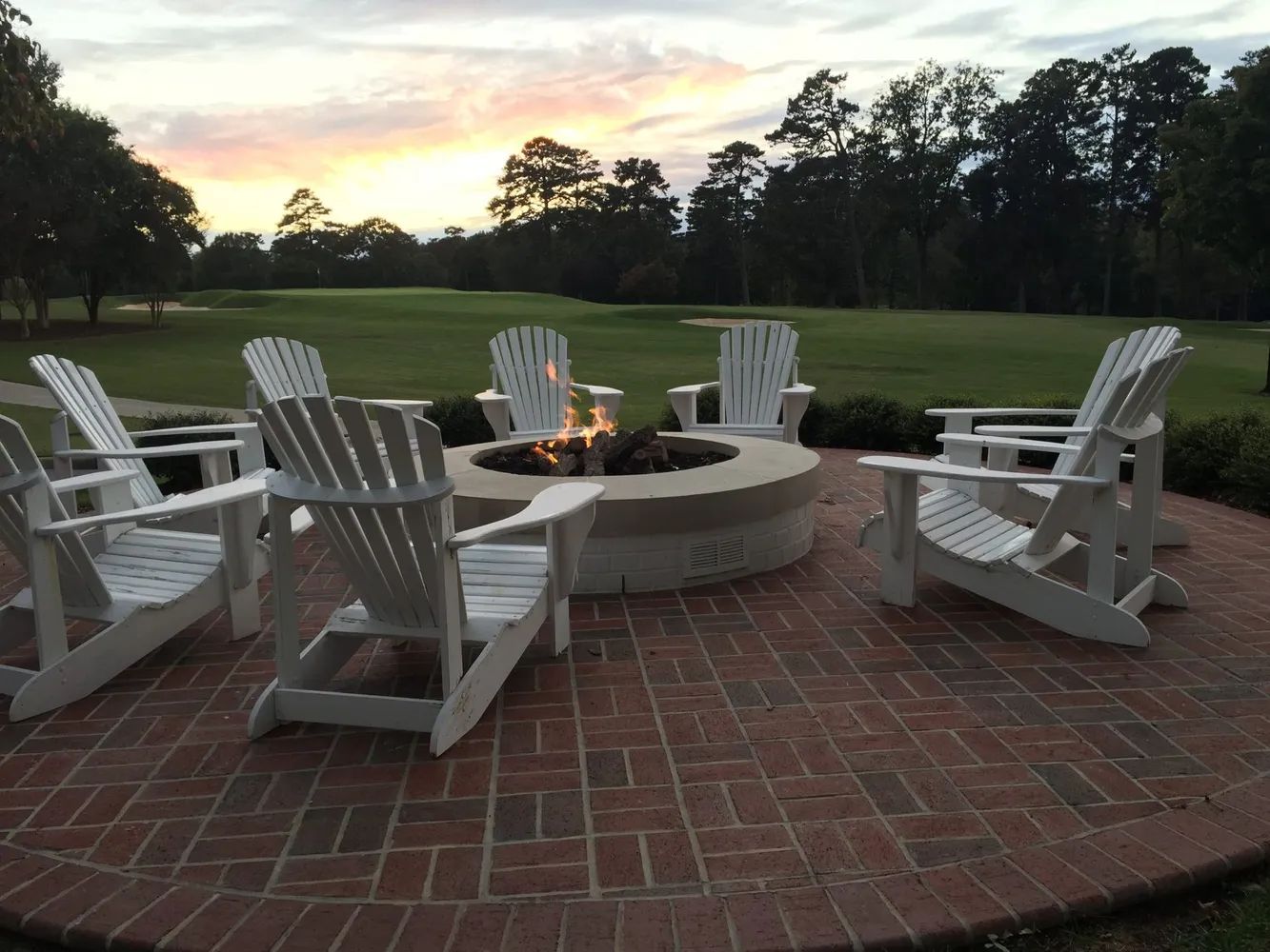 Clay brick patio circular fir ring seating patio space on golf course in Minnesota 