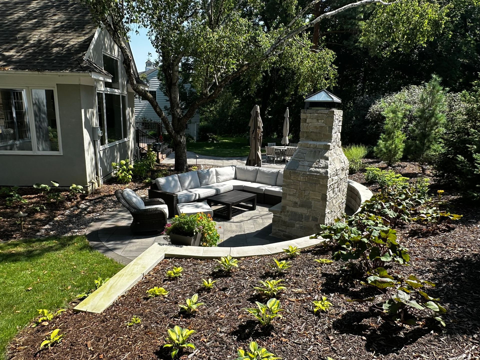 backyard landscaping with seating and fire pit