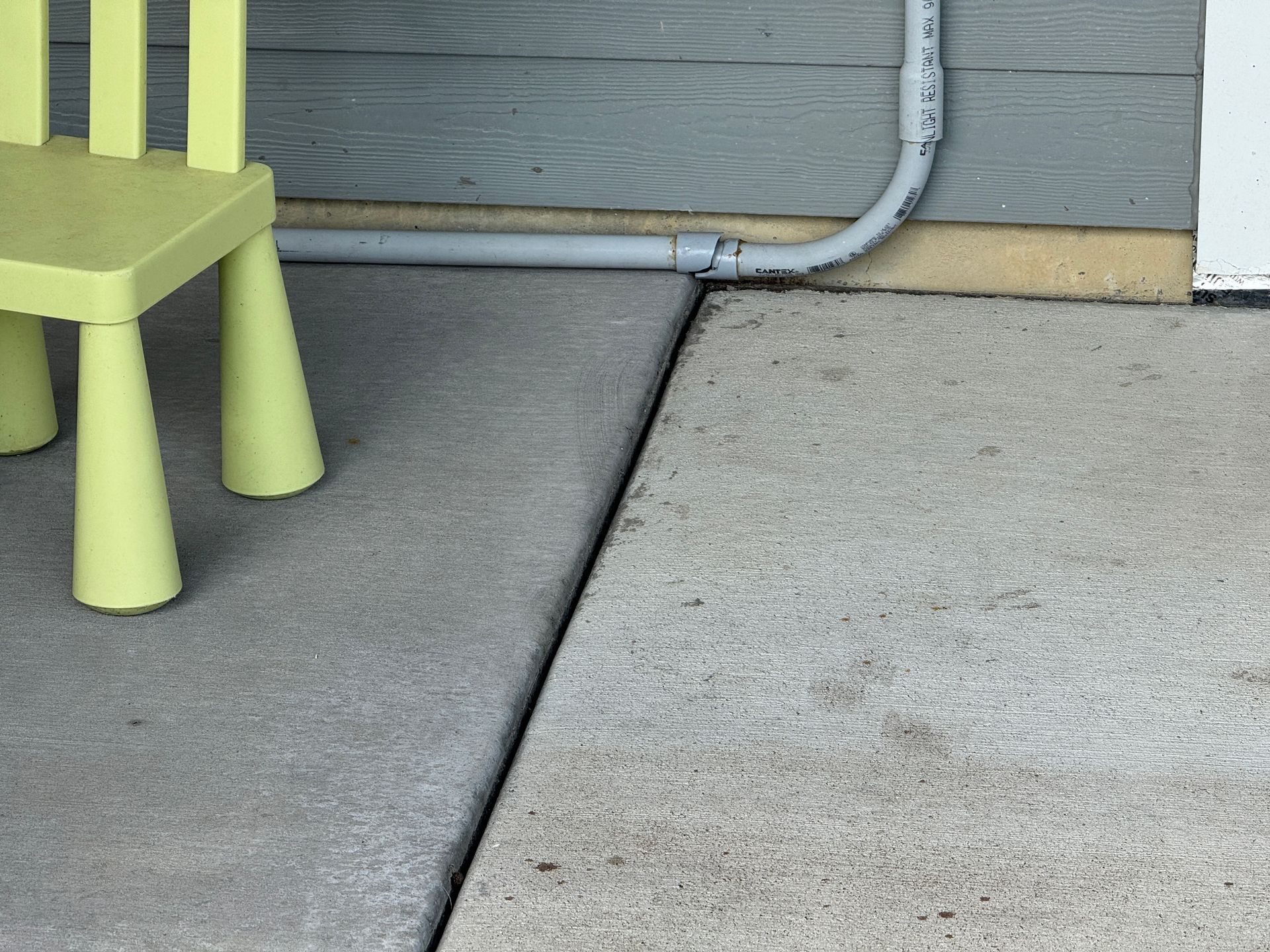 heaving patio in wet clay soil in Plymouth lifted and cracked the electrical conduit for the hot tub