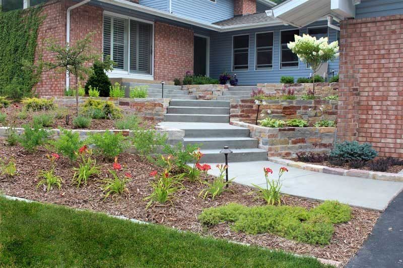 Custom front yard courtyard redesign renovation project with concrete steps and landing in Mendota Heights MN by KG Landscape