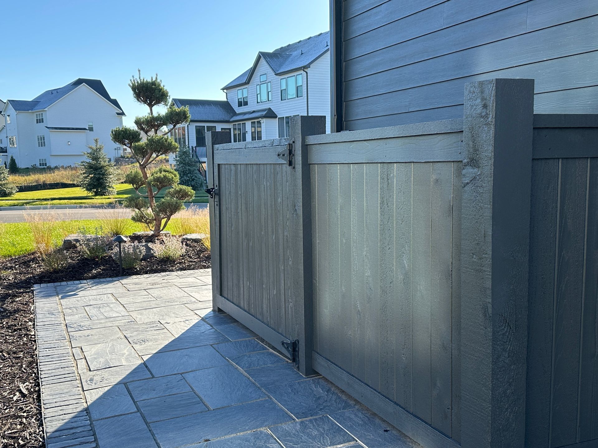 Screen fence painted to match siding high end design detail.