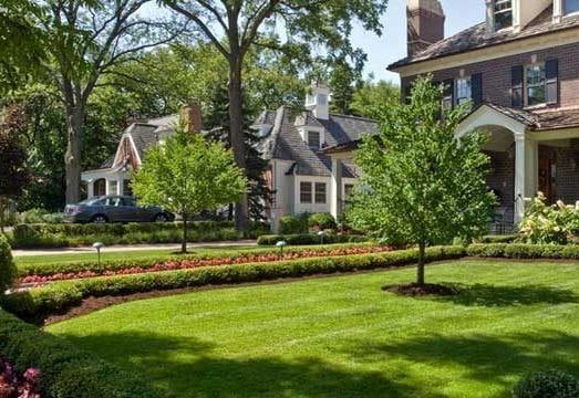perfect green grass and nice landscaping with flowers 