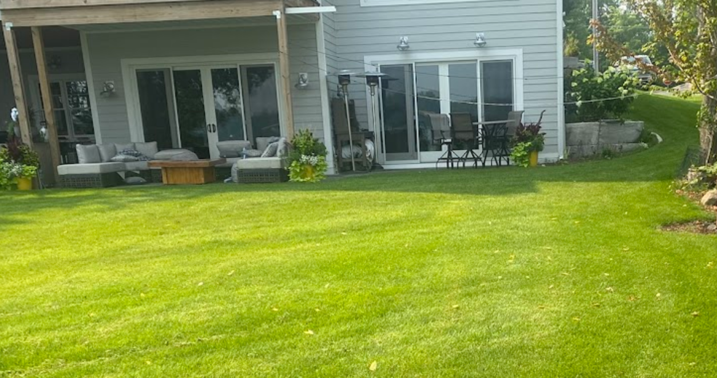 Healthy thick grass in backyard of Minnesota home. 