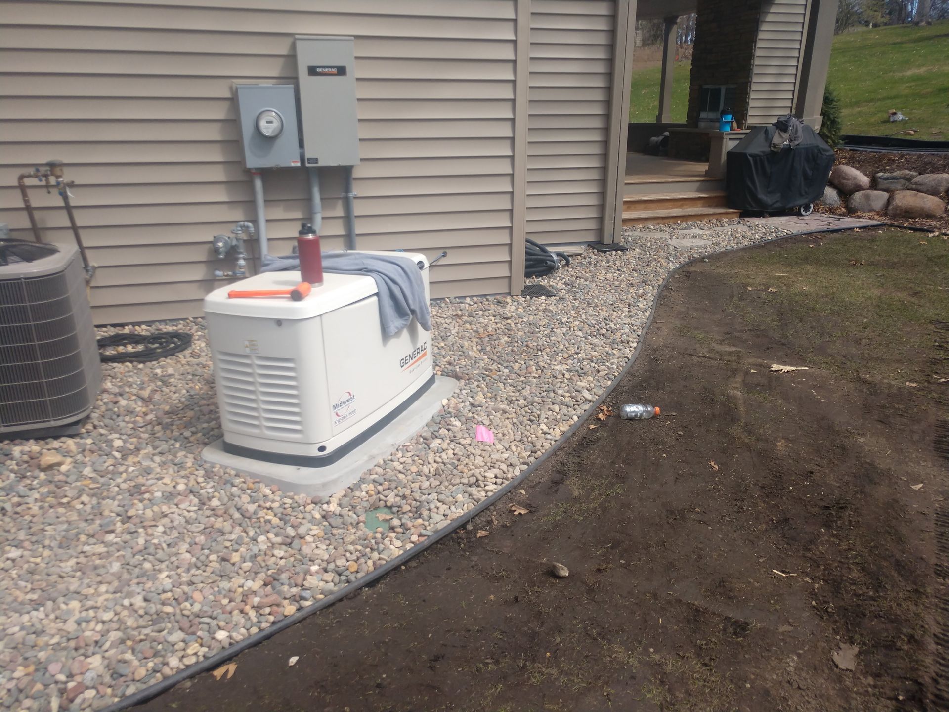 Regrading a yard to slope away from a house foundation