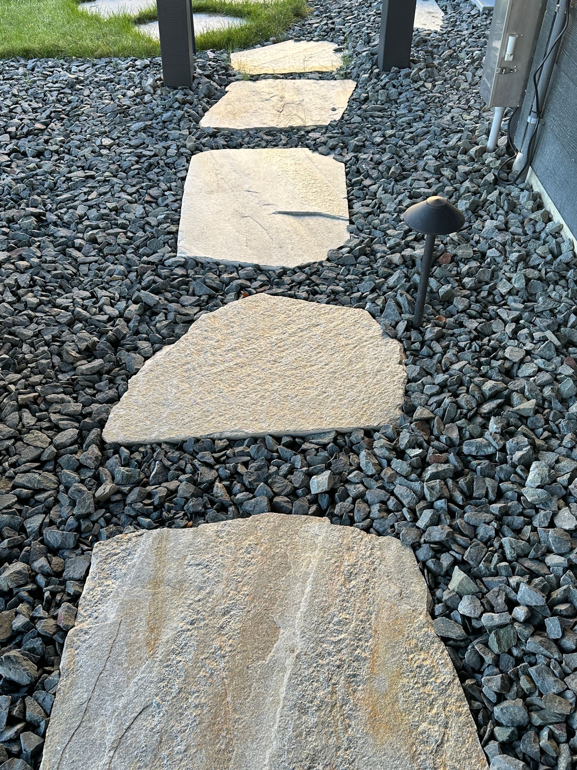 flagstone pathway steppers below deck leading to hot tub in hill