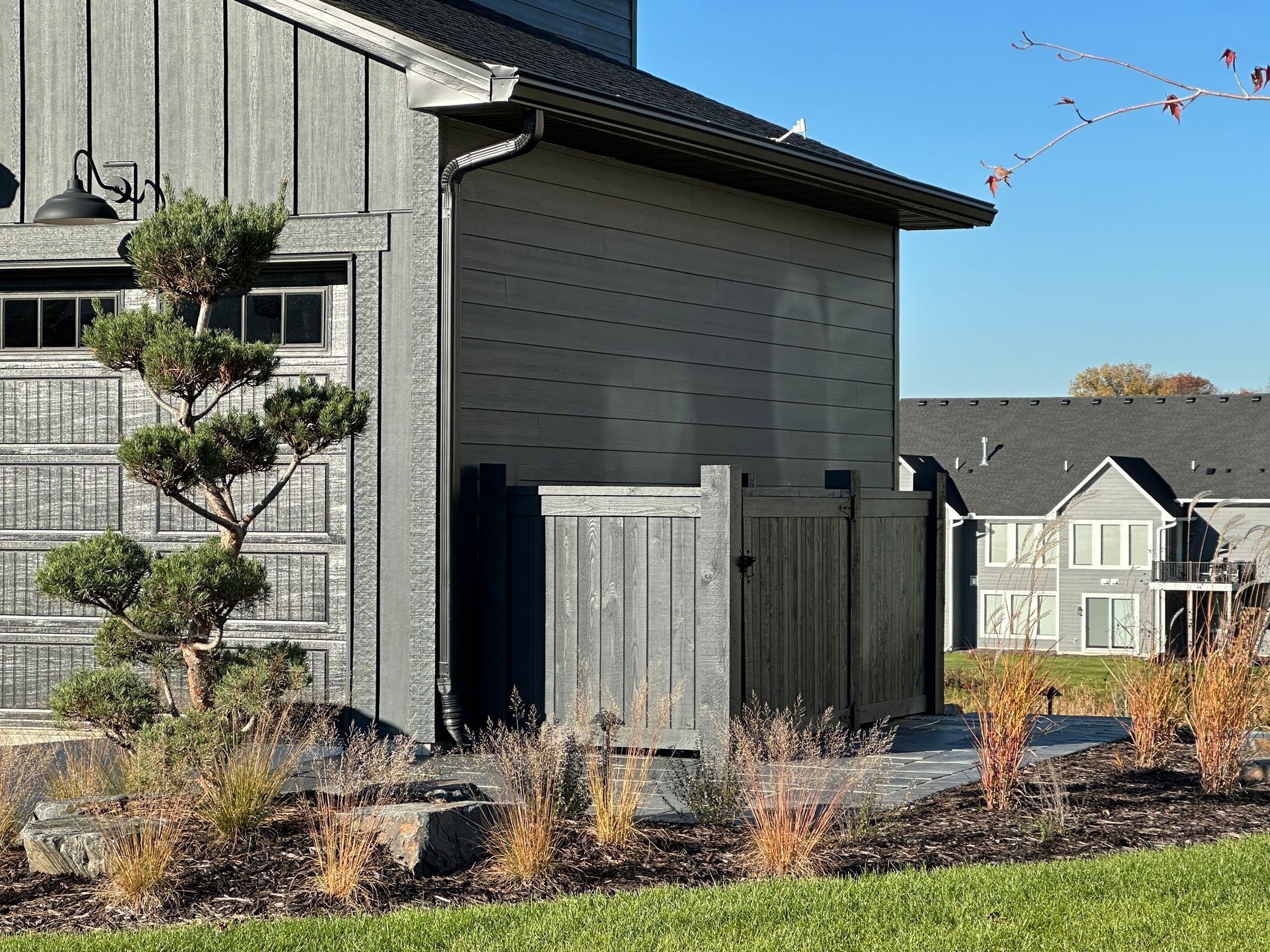 high end design feature hiding trash bin storage area