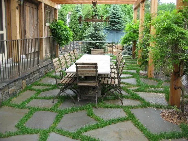 Flagstone patio with grass between the stones