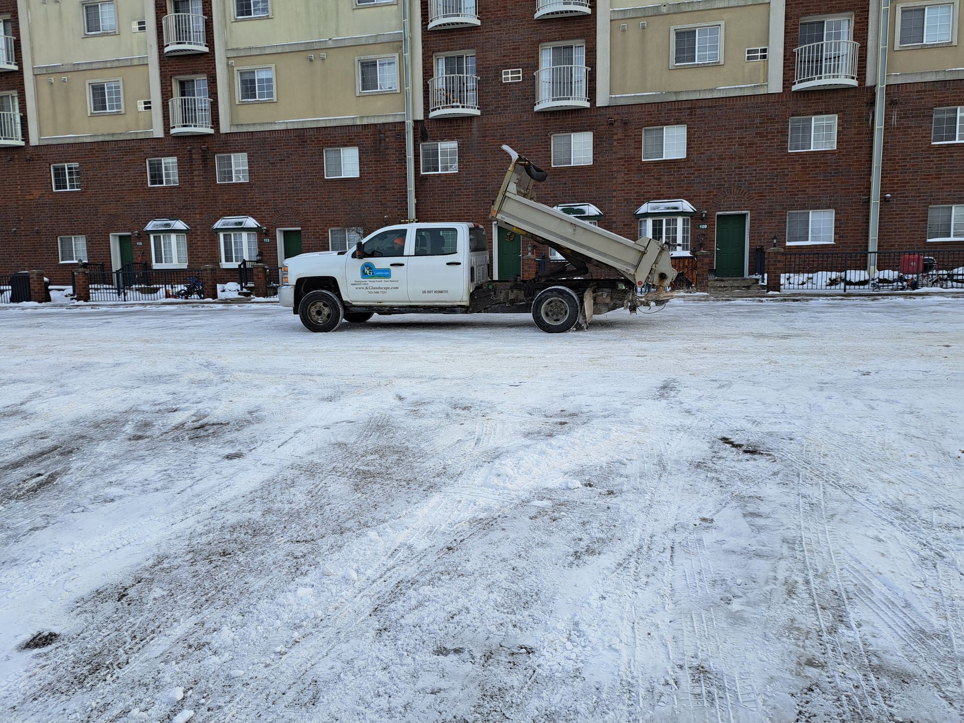 KG Landscape truck applying salt to a commercial parking lot in Minnesota
