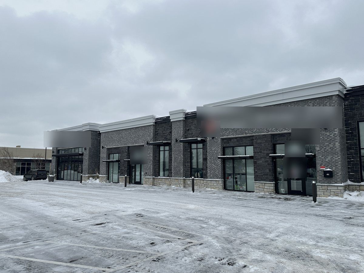 Newer storefront row with its parking area plowed