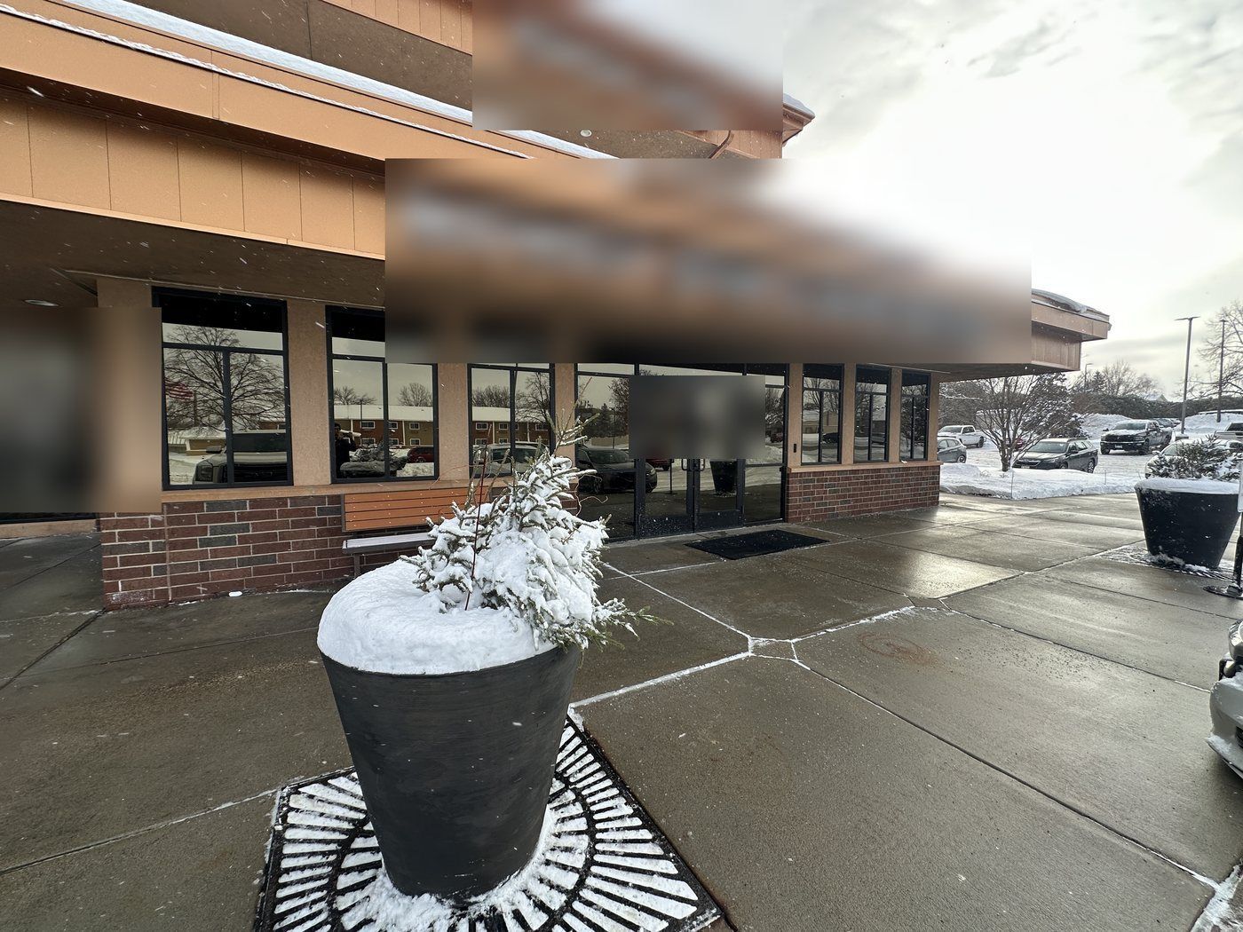 Cleared and salted walk in front of ground-floor office entrances