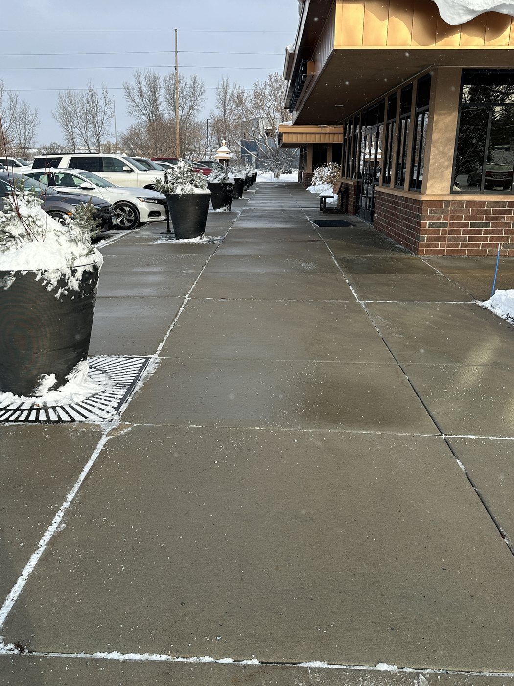 Cleared concrete walk beside the length of an office building