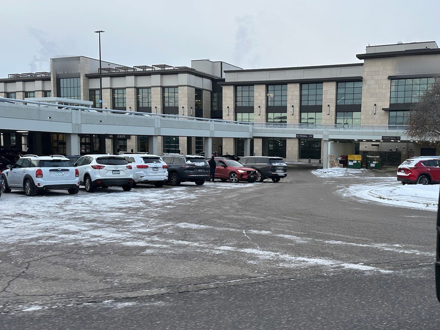 Cleared entry drive leading to a multi-story office building